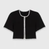 Gecropte vest met stiksels