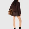 Korte cropped mantel
