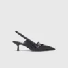 Leren pumps met bandje met oogjes
