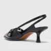 Leren pumps met bandje met oogjes