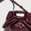 Milpli mini-clutch van gekraakt leer