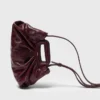 Milpli mini-clutch van gekraakt leer
