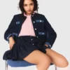 Tweedjasje met denimrand