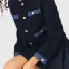 Tweedjasje met denimrand
